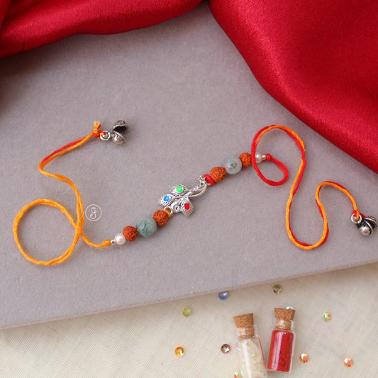 Krishna’s Flute Rakhi with Feather & Rudraksha