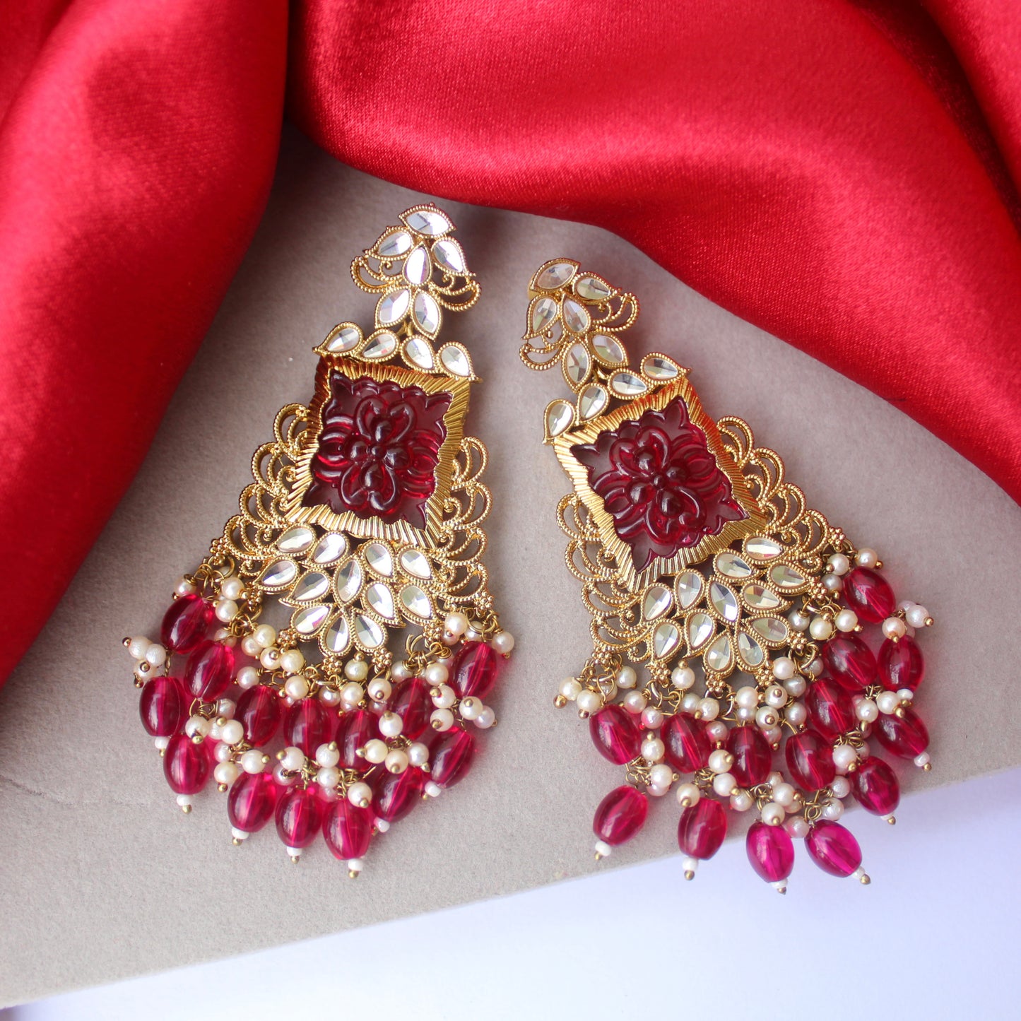 Beautifully Carved Ruby Earrings with Antique Gold Finish