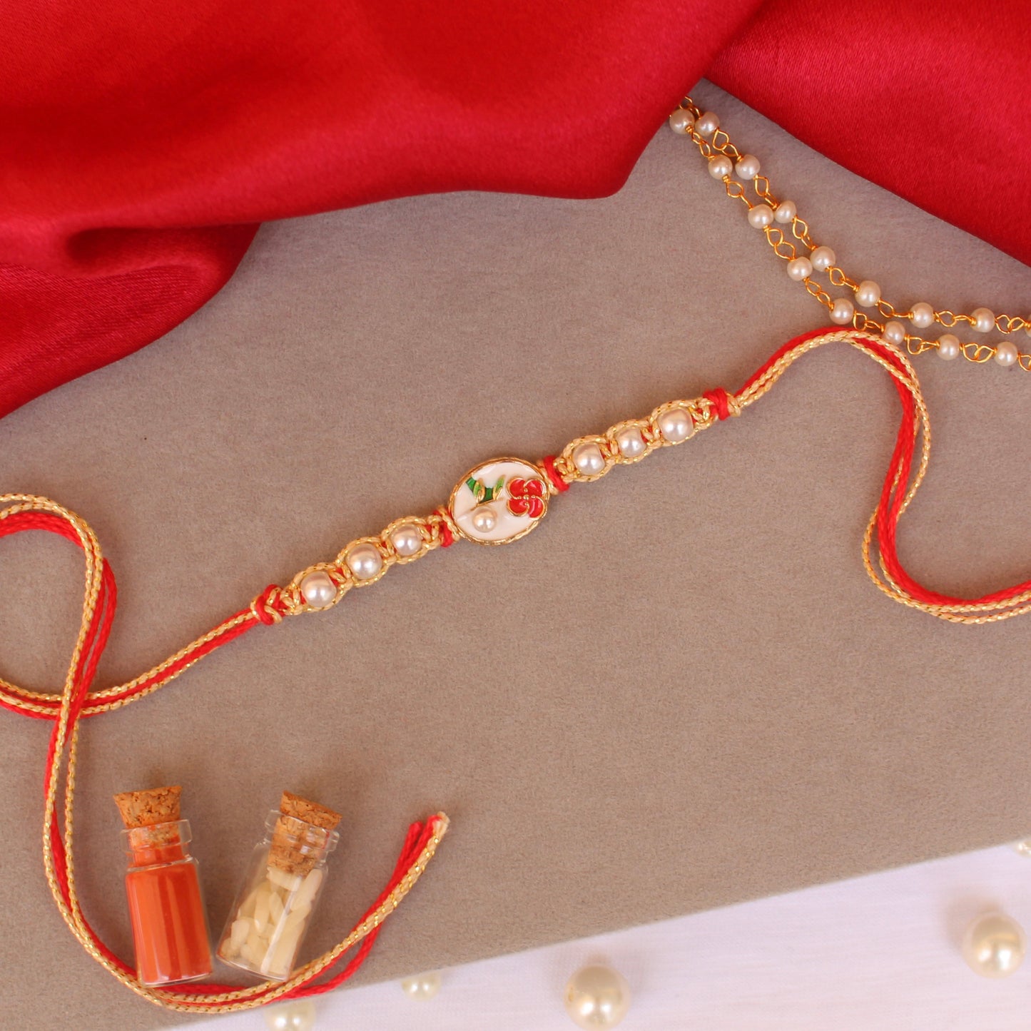 White Floral Rakhi & Bracelet Pair