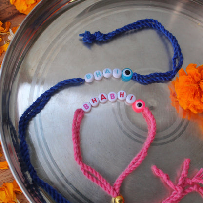 Blue & Pink Bhai-Bhabhi Alphabets Rakhi